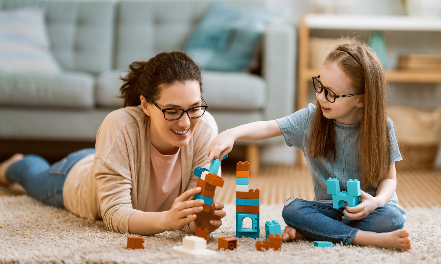 Daughter and Mother Playing With Lego Blocks